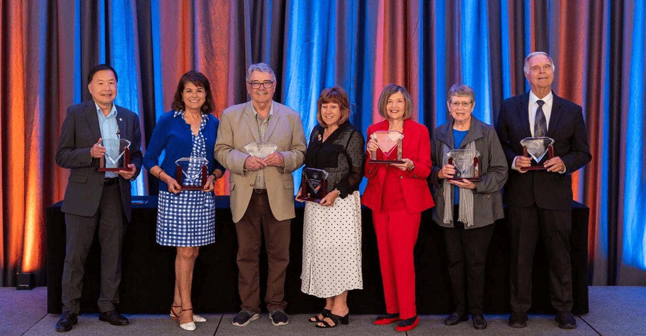 Dr. Barbara Dunsheath with the other six Trustee winners