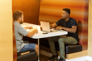 two guys with laptop