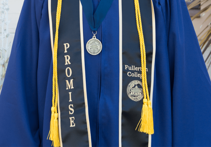 Graduation gown with Promise program logo