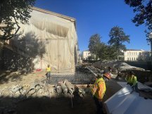 exterior of a building with plastic sheeting on the sides